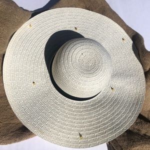 Sun hat with gold spike embellishments